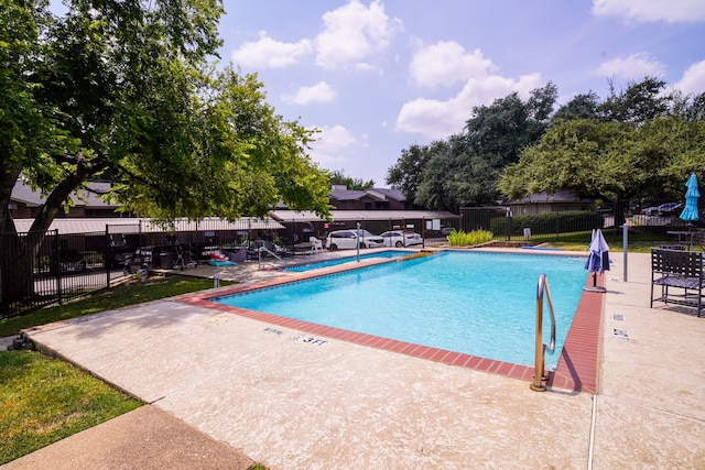 view of pool featuring a patio area