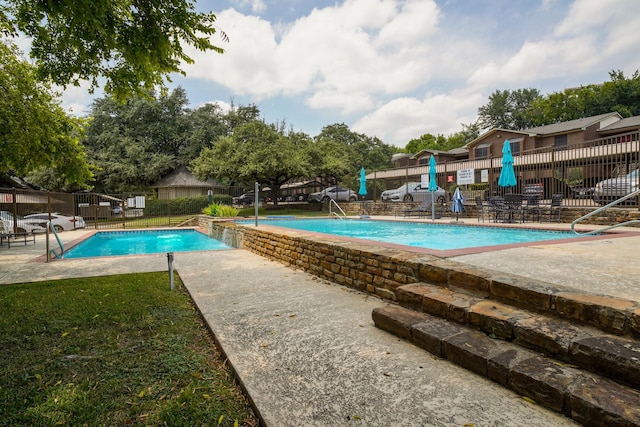 view of pool with pool water feature