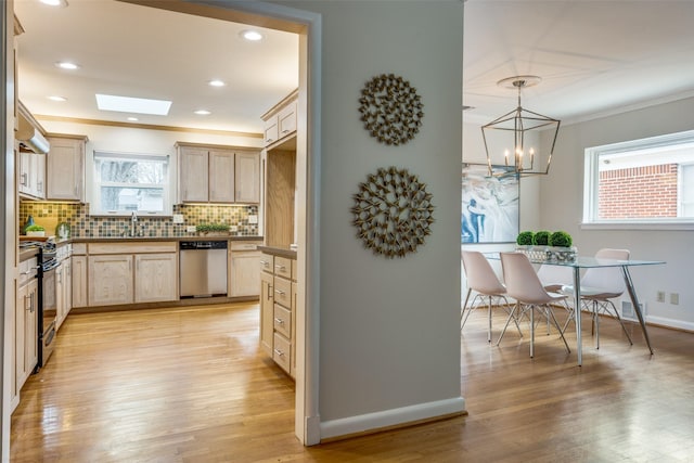 kitchen with light brown cabinetry, electric range, dishwasher, a healthy amount of sunlight, and backsplash