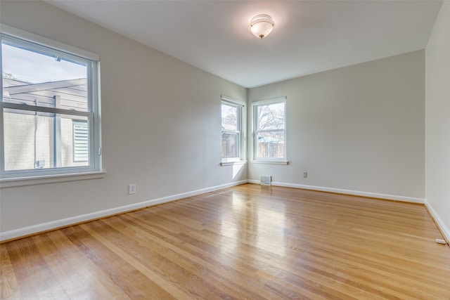 spare room with light hardwood / wood-style floors