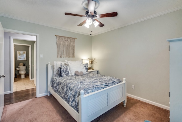 carpeted bedroom with ornamental molding and ceiling fan