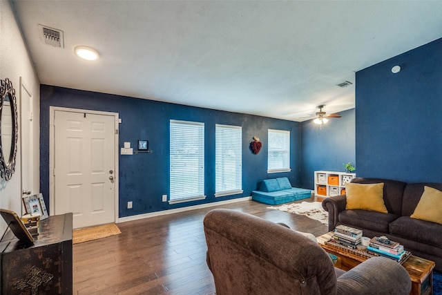 living room with hardwood / wood-style flooring and ceiling fan