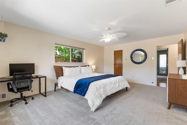 bedroom with light colored carpet and ceiling fan