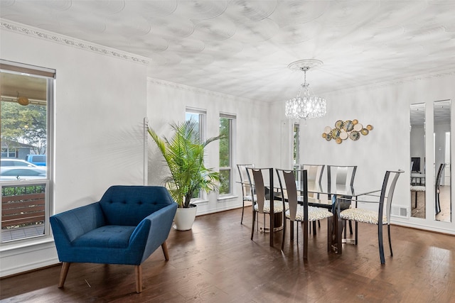 dining space with an inviting chandelier, dark hardwood / wood-style floors, and a healthy amount of sunlight