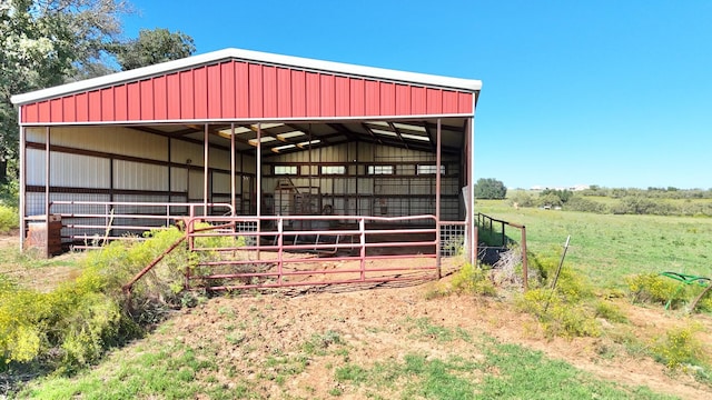 view of outdoor structure with a rural view