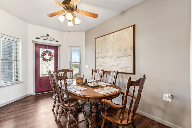 dining room featuring ceiling fan and dark hardwood / wood-style flooring