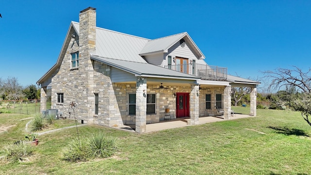 exterior space featuring a patio area, central air condition unit, a balcony, a yard, and ceiling fan