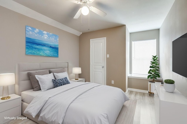 bedroom with ceiling fan and light wood-type flooring