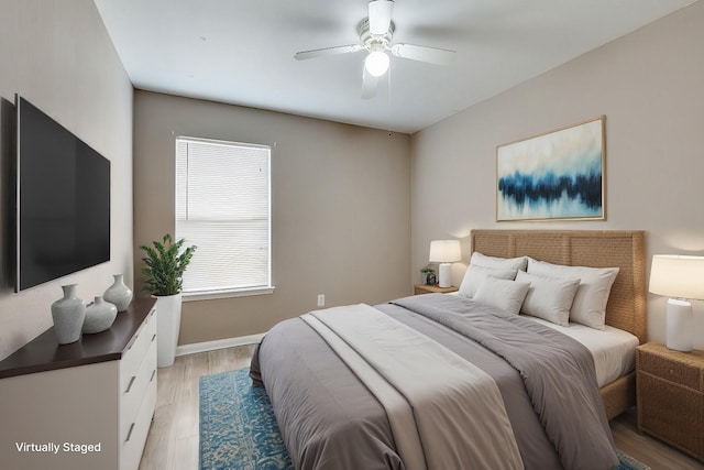 bedroom featuring ceiling fan and light hardwood / wood-style flooring