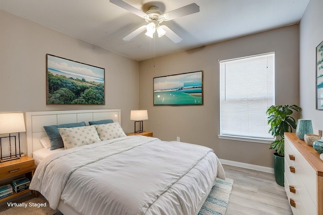 bedroom featuring ceiling fan and light wood-type flooring