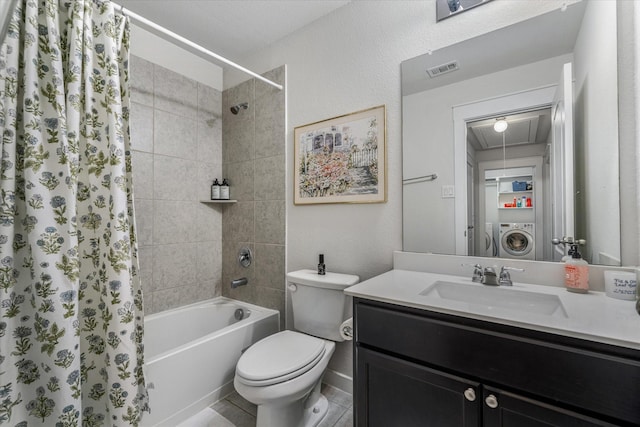 full bathroom featuring vanity, washer / clothes dryer, shower / bath combination with curtain, and toilet