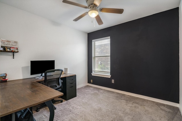 office space featuring ceiling fan and light carpet