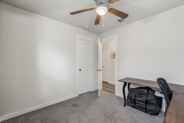 home office with carpet floors and ceiling fan