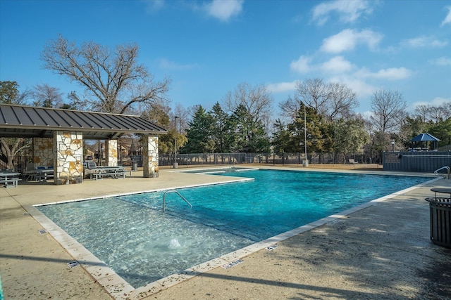 view of swimming pool featuring a patio