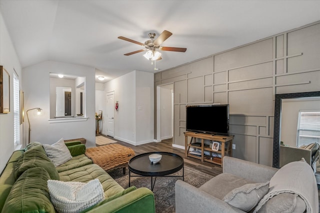 living room with dark hardwood / wood-style floors and ceiling fan