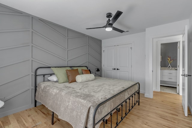 bedroom featuring ceiling fan, a closet, and light wood-type flooring