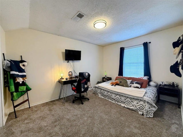 carpeted bedroom featuring vaulted ceiling and a textured ceiling