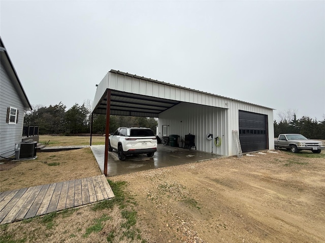 view of vehicle parking with a garage