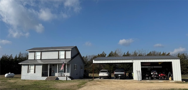 view of front of house featuring a garage and covered porch