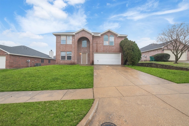 view of front of property featuring a garage and a front yard