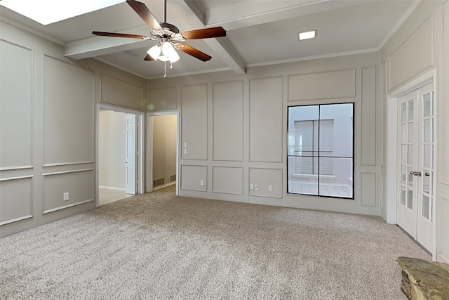 unfurnished bedroom featuring light carpet, crown molding, and beamed ceiling