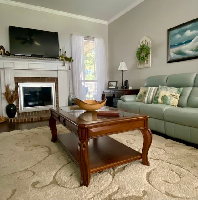 living room with hardwood / wood-style flooring, a fireplace, ornamental molding, and vaulted ceiling