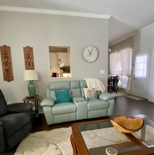 living room featuring crown molding and hardwood / wood-style floors