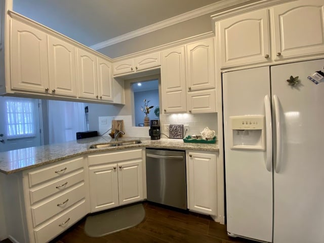 kitchen with sink, white fridge with ice dispenser, stainless steel dishwasher, light stone counters, and kitchen peninsula