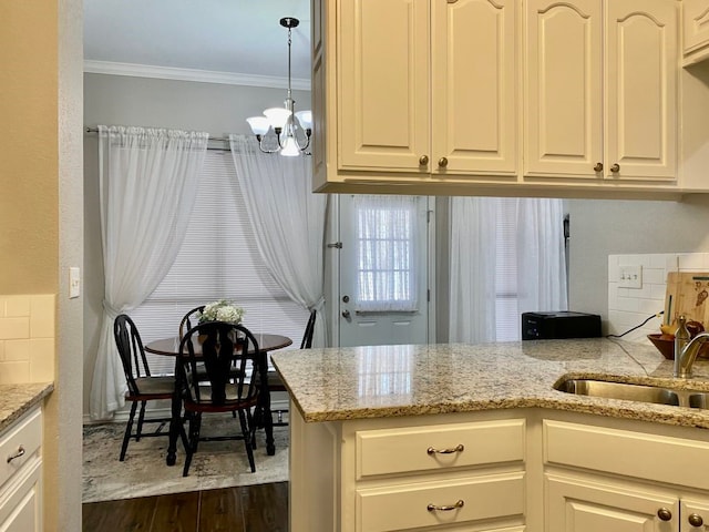 kitchen featuring sink, dark wood-type flooring, ornamental molding, light stone countertops, and decorative backsplash