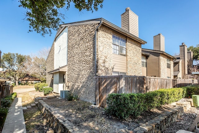 view of home's exterior with cooling unit