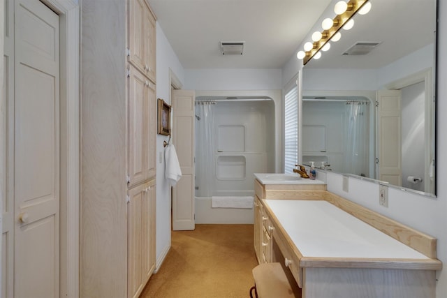 bathroom featuring vanity and  shower combination