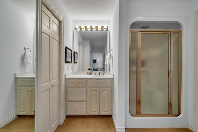 bathroom with vanity and walk in shower