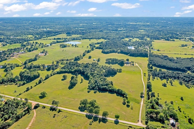 birds eye view of property with a rural view