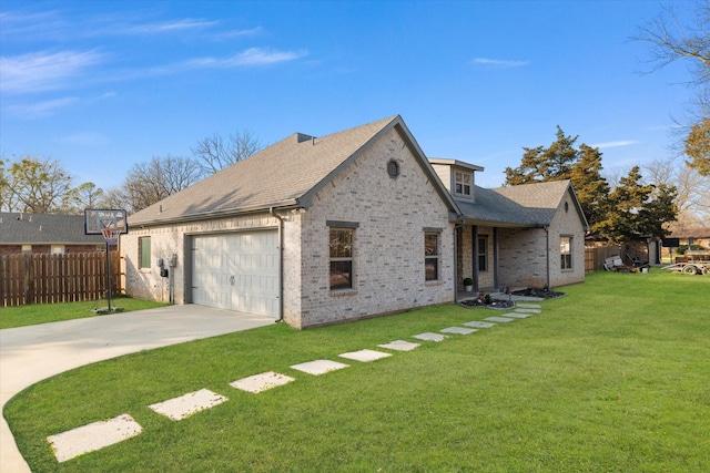 view of front of home featuring a garage and a front yard