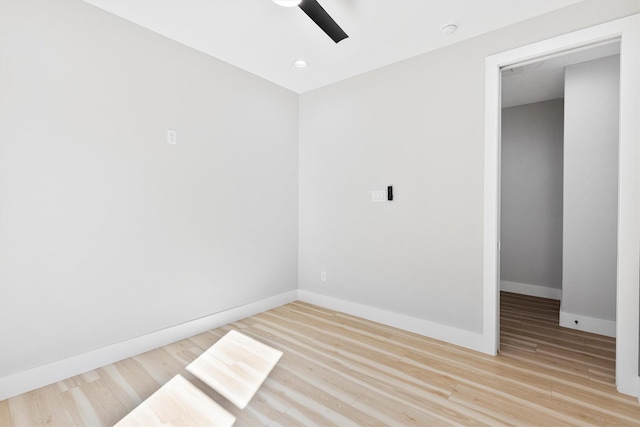 empty room with light hardwood / wood-style flooring and ceiling fan