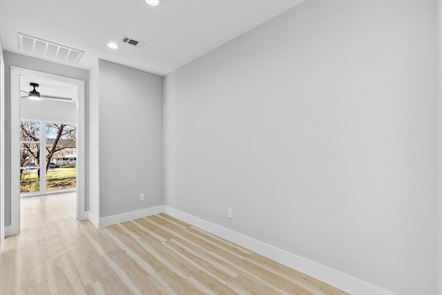 unfurnished room featuring ceiling fan and light hardwood / wood-style floors