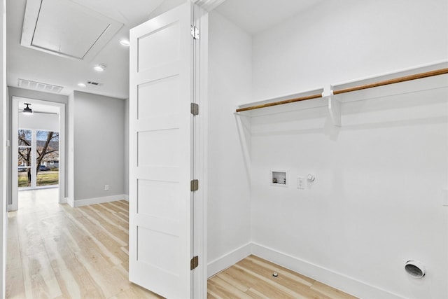 laundry area with gas dryer hookup, washer hookup, light hardwood / wood-style floors, and electric dryer hookup