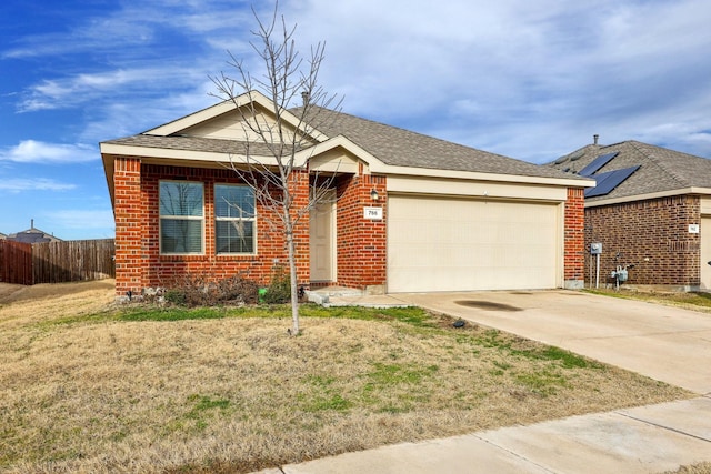 view of front of property featuring a garage and a front yard