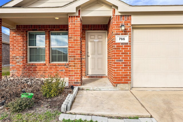 doorway to property featuring a garage