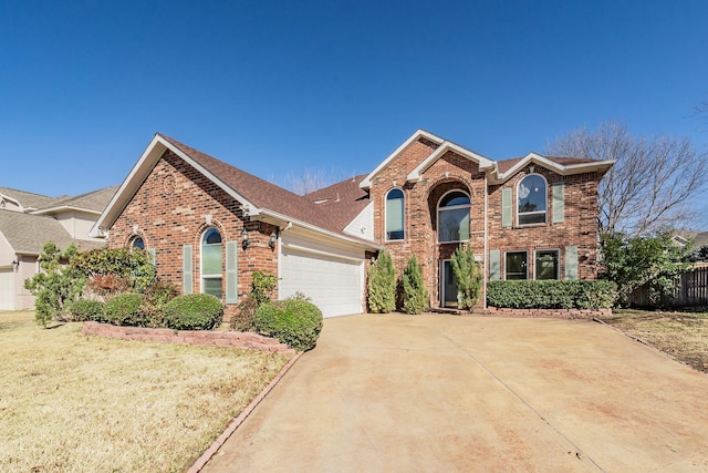 front facade featuring a garage and a front yard