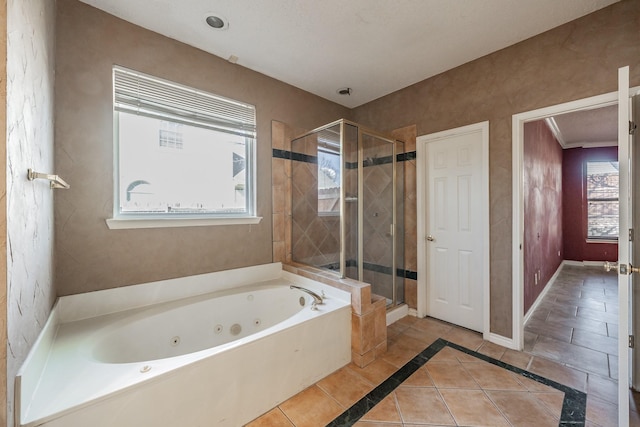 bathroom with tile patterned flooring and independent shower and bath