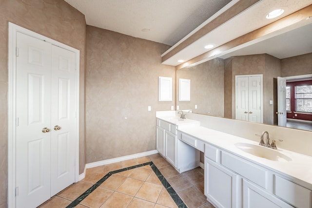 bathroom featuring tile patterned flooring and vanity