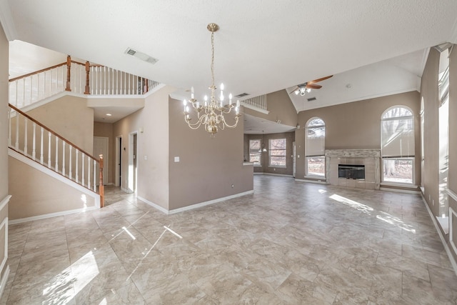 unfurnished living room with high vaulted ceiling, ceiling fan with notable chandelier, a textured ceiling, and a fireplace