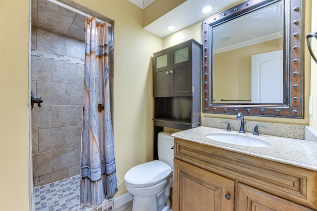 bathroom with walk in shower, ornamental molding, vanity, and toilet