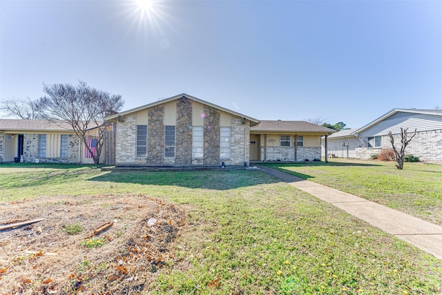 ranch-style house with a front lawn