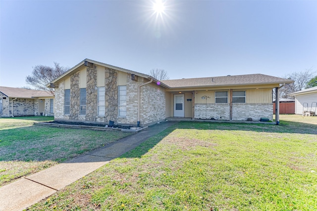 ranch-style home with a front lawn