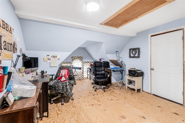 office space featuring lofted ceiling and wood finished floors