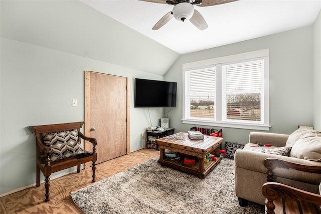 living area featuring vaulted ceiling, wood finished floors, and ceiling fan