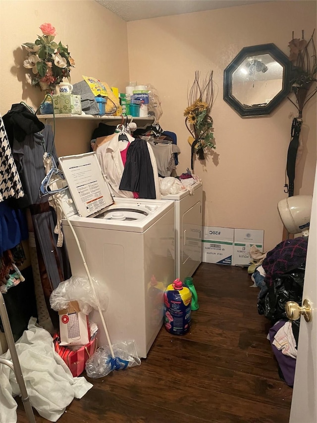 washroom featuring hardwood / wood-style flooring and washing machine and clothes dryer