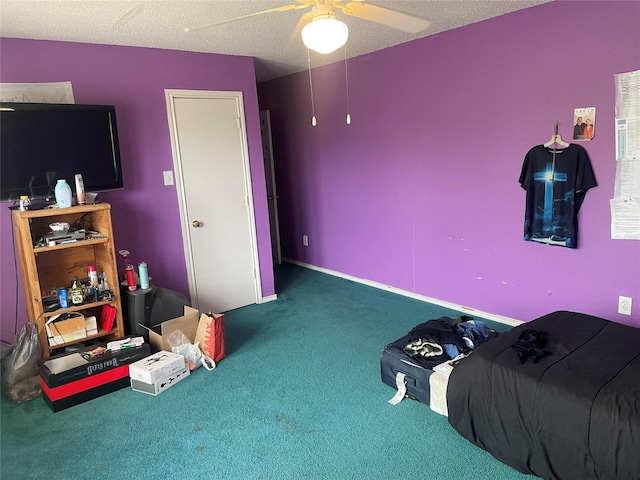 bedroom with a textured ceiling, ceiling fan, and carpet flooring